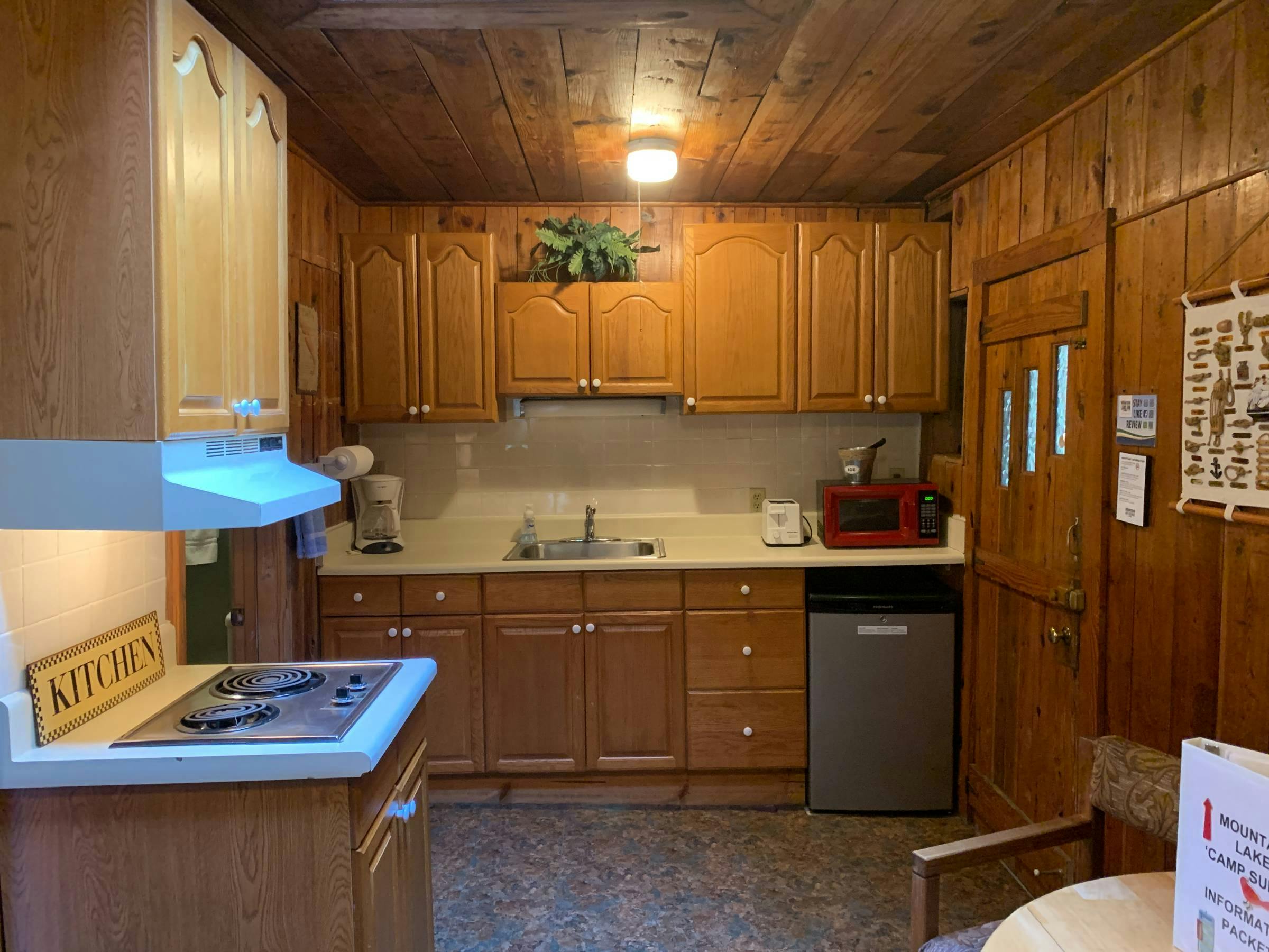 Kitchenette with 2 plate burner, microwave, coffee pot(filters provided), toaster and under counter fridge. Ice available in the laundry room.