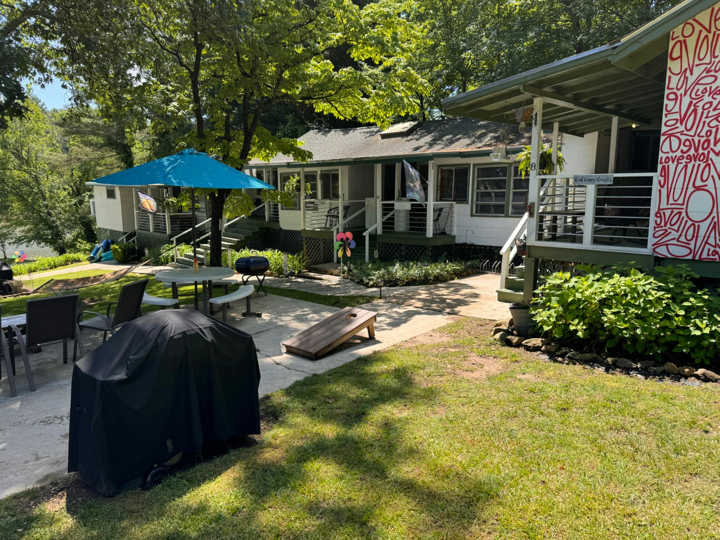Shared area with picnic tables, corn hole, grills, hammock and fire pits.