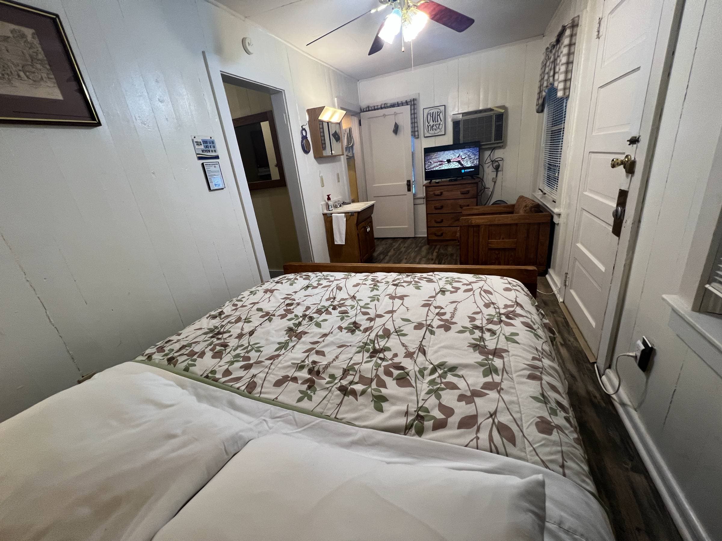 Queen bed with flat screen TV.